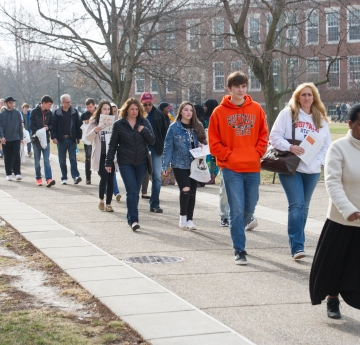 Picture of student walking on campus